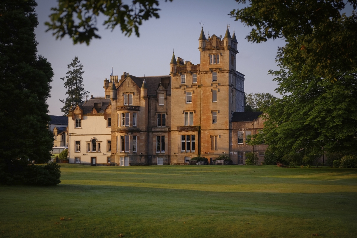 The Cameron House building with a lush green lawn in front