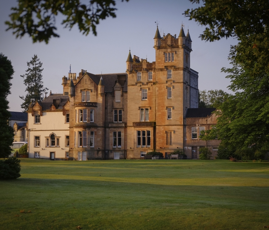 The Cameron House building with a lush green lawn in front