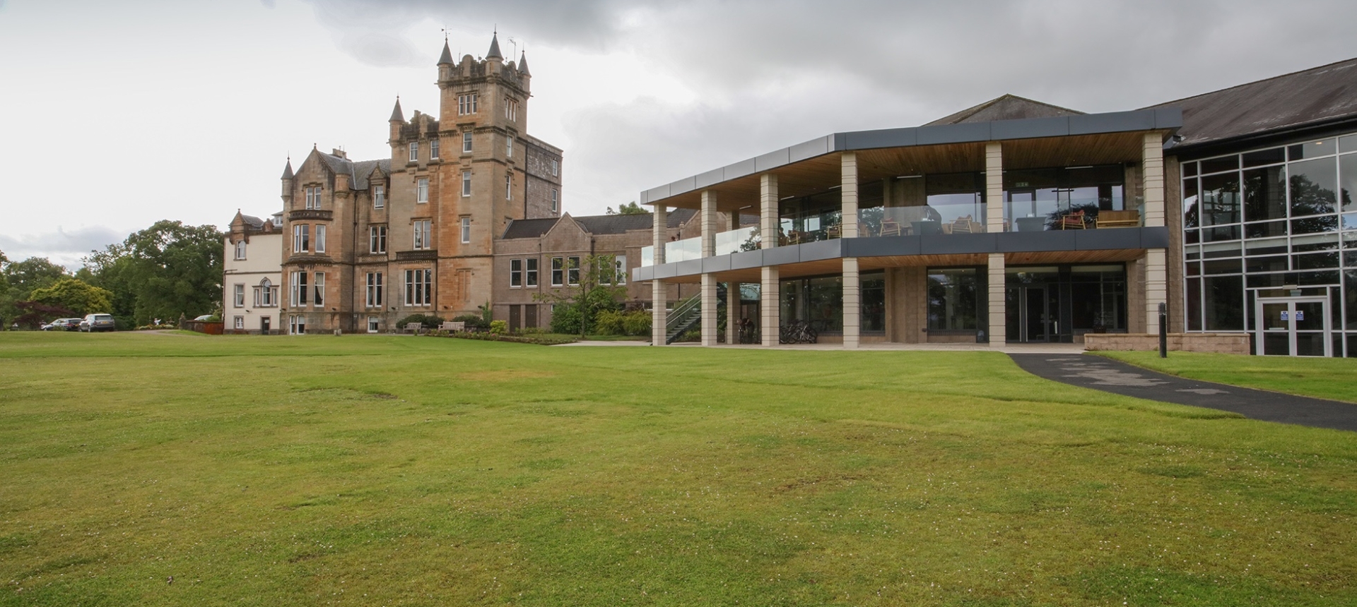 Exterior of Cameron House with a lush green lawn in the forground