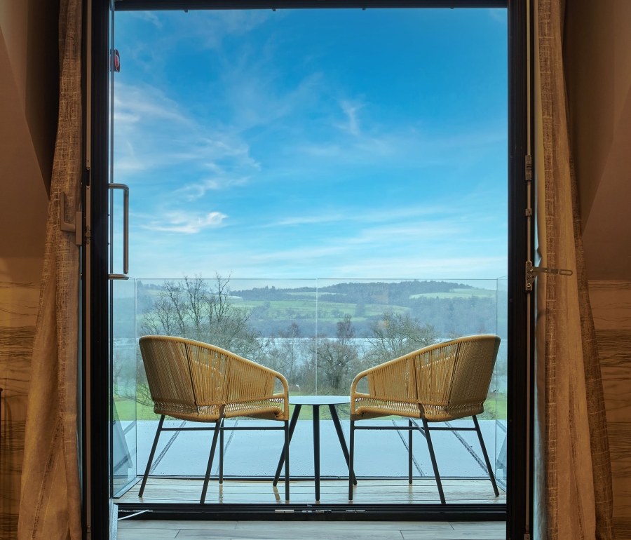 the entrance way to a patio sitting area over looking the amazing out door views