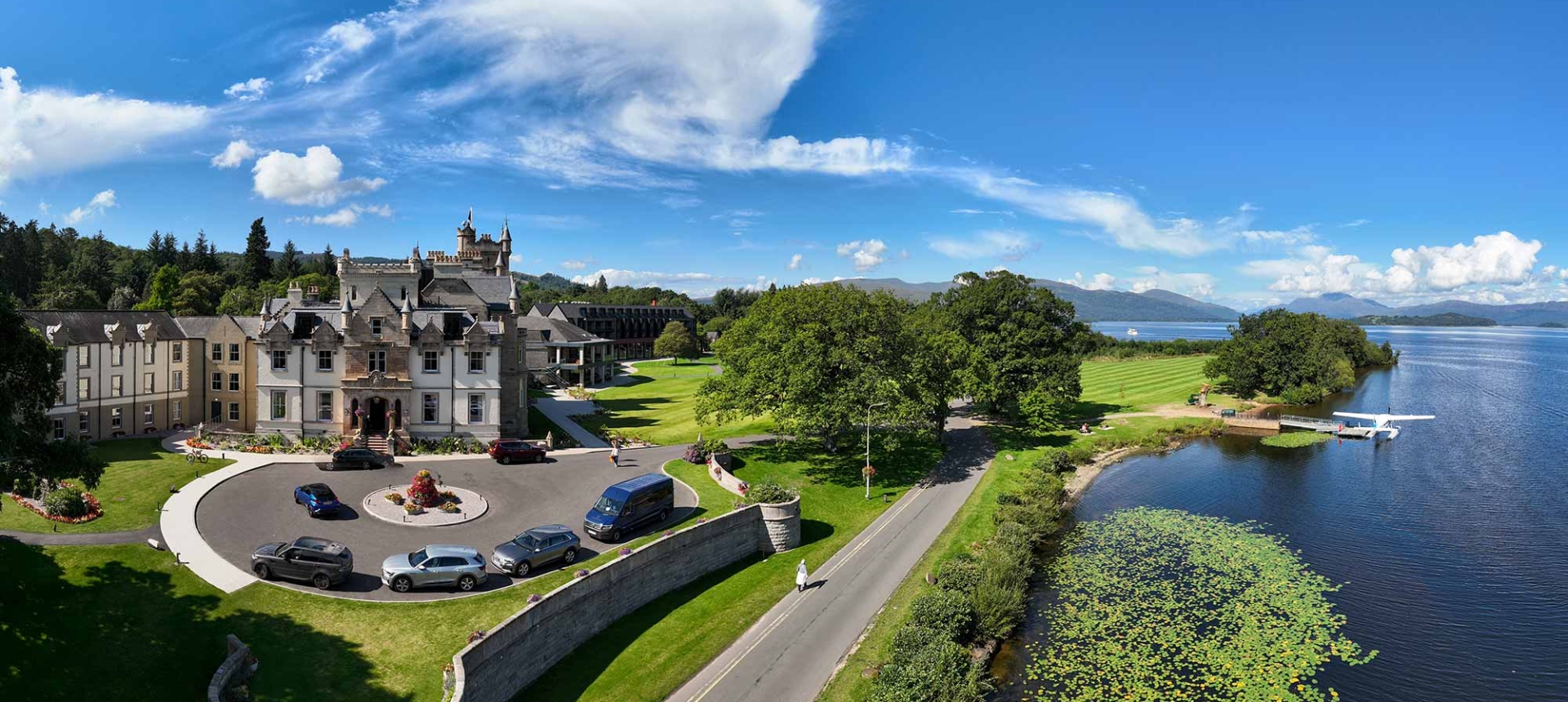 birds eye view of cameron house and its surroundings on a beautiful day