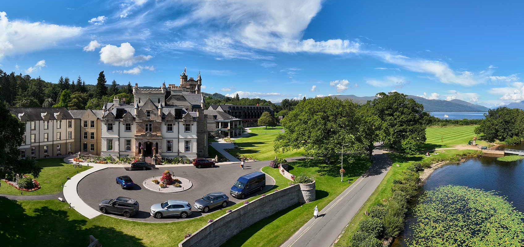 birds eye view of cameron house and its surroundings on a beautiful day