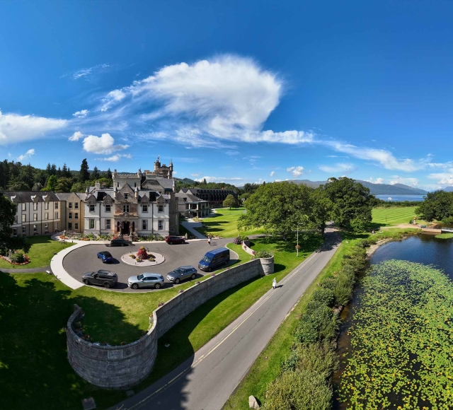 birds eye view of cameron house and its surroundings on a beautiful day