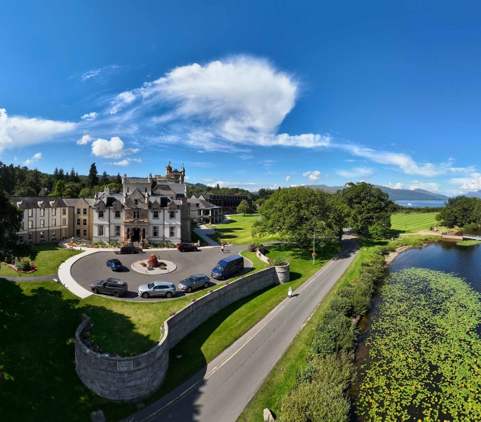birds eye view of cameron house and its surroundings on a beautiful day