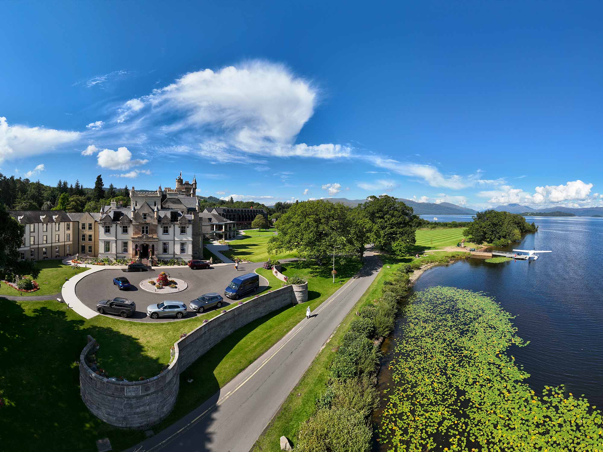 birds eye view of cameron house and its surroundings on a beautiful day