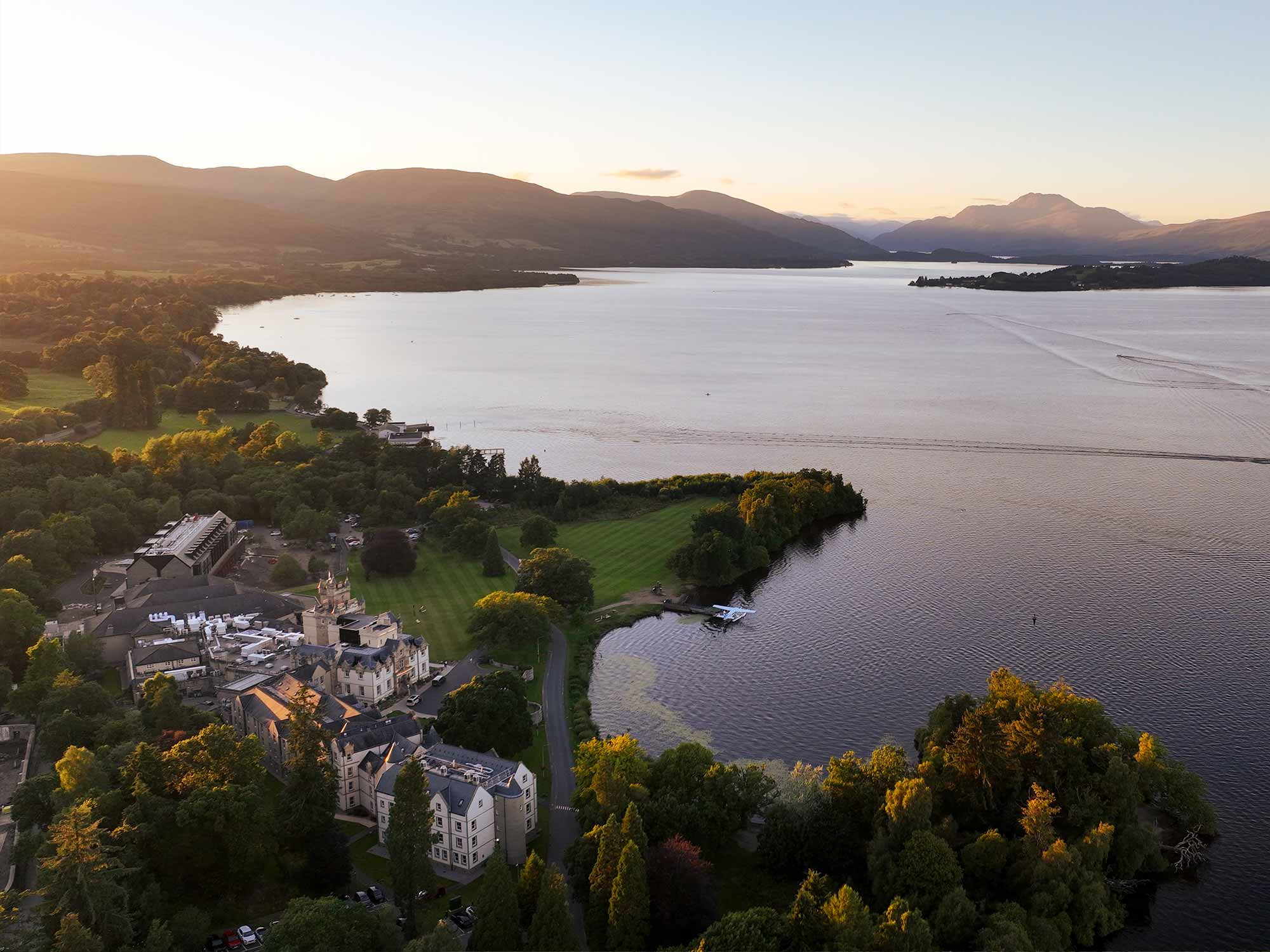 a bids eye view over looking cameron house and the large body of water surrounding it
