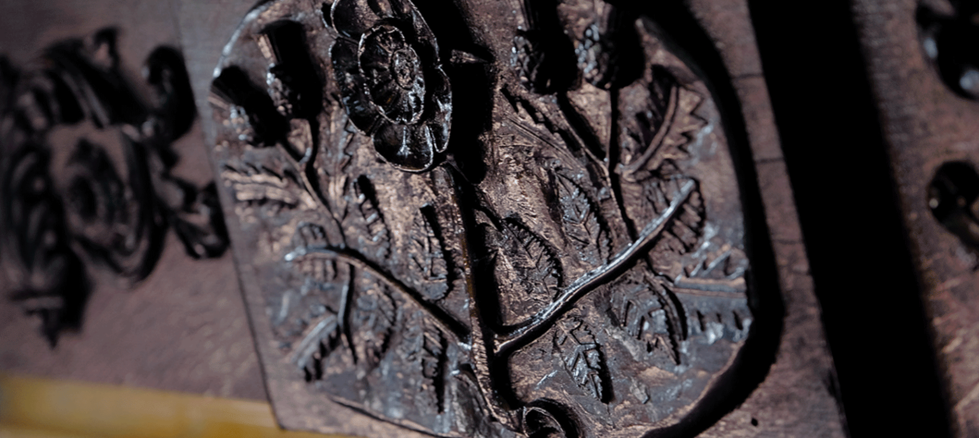 a close up view of a carving in a piece of wood