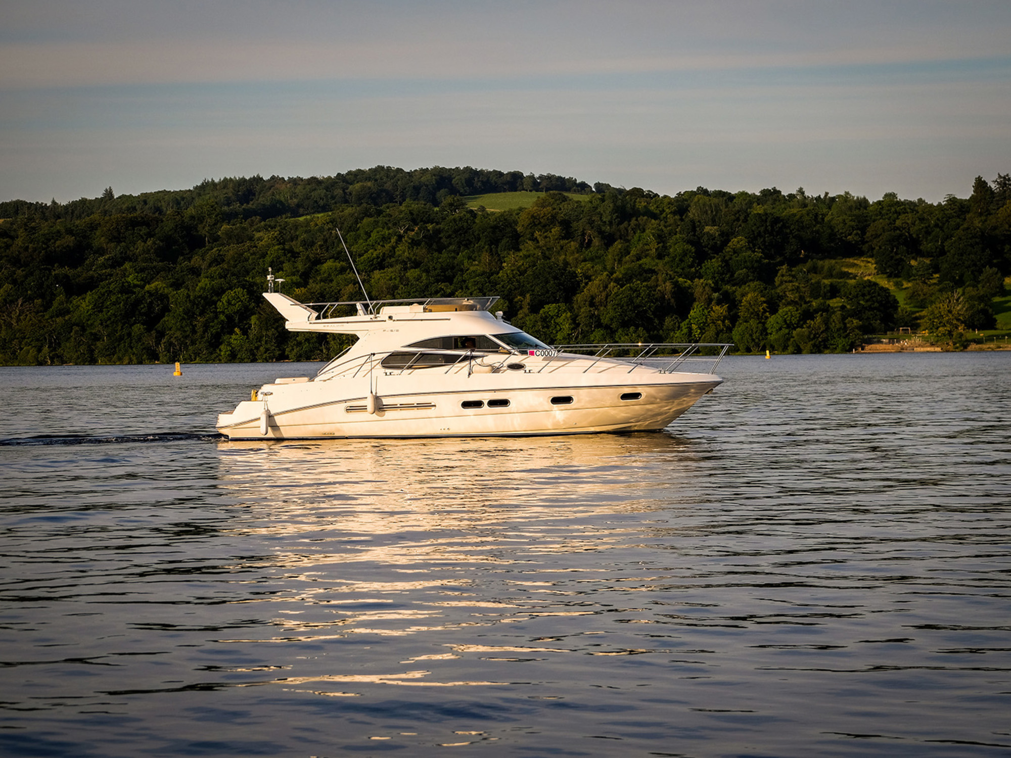 A pleasure boat on the waters of Loch Lomond, near Cameron House Hotel Scotland