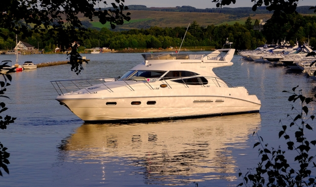 Champagne cruise pleasure boat in Cameron House Marina harbour on Loch Lomond