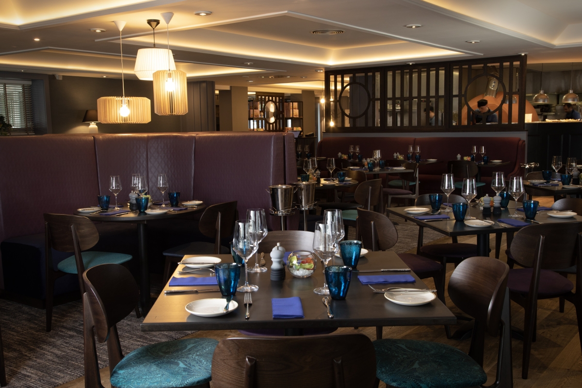 La Vista restaurant's dining area with dark wooden tables and chairs