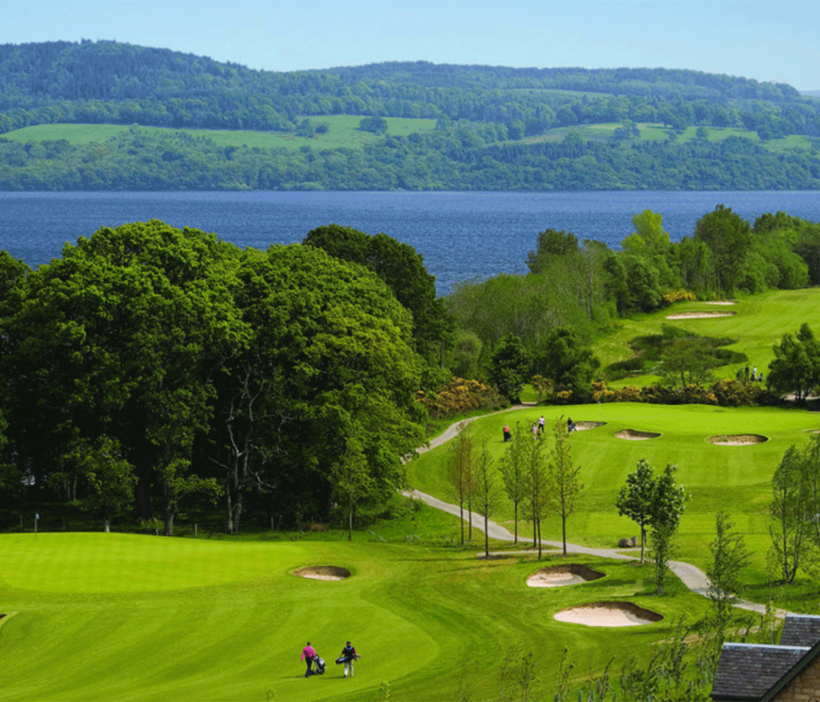 a over head view of a golf course with people playing golf below