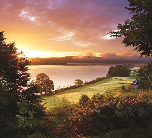 a view of the sunset and lake