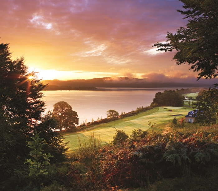 a view of the sunset and lake