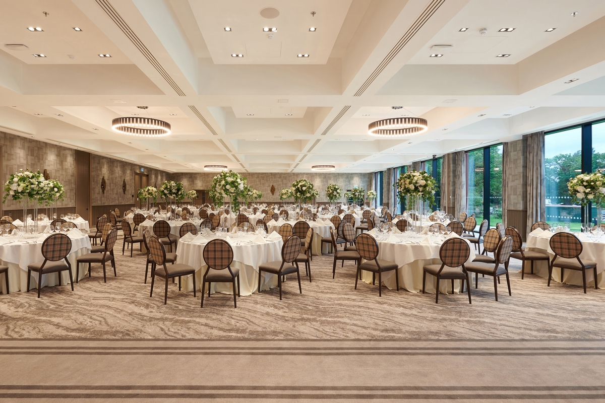 elegant wedding setup with chairs and never ending chairs and tables and beautiful outdoor views