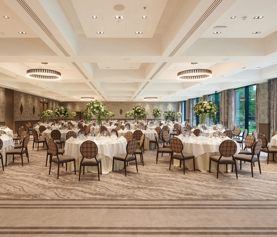 elegant wedding setup with chairs and never ending chairs and tables and beautiful outdoor views