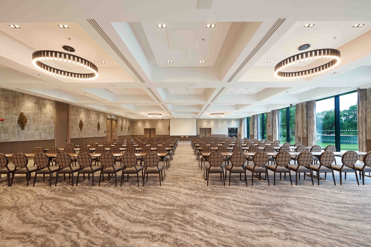 Expansive meeting room with amazing lighting and full sized windows to view the outside trees