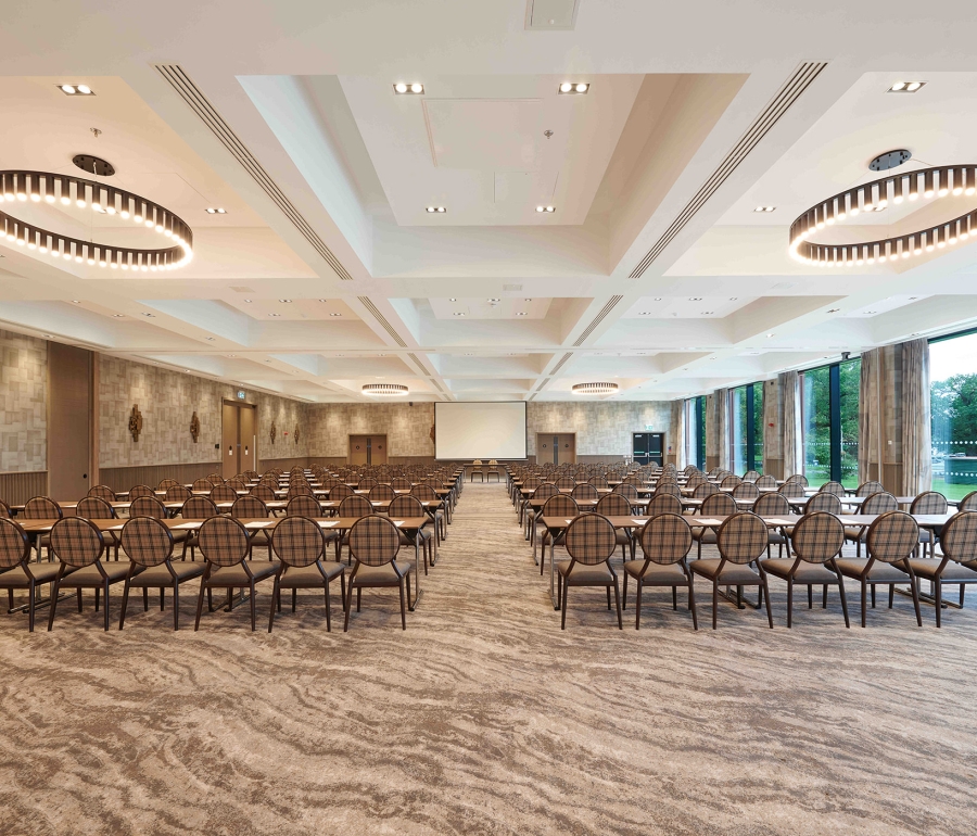 Expansive meeting room with amazing lighting and full sized windows to view the outside trees