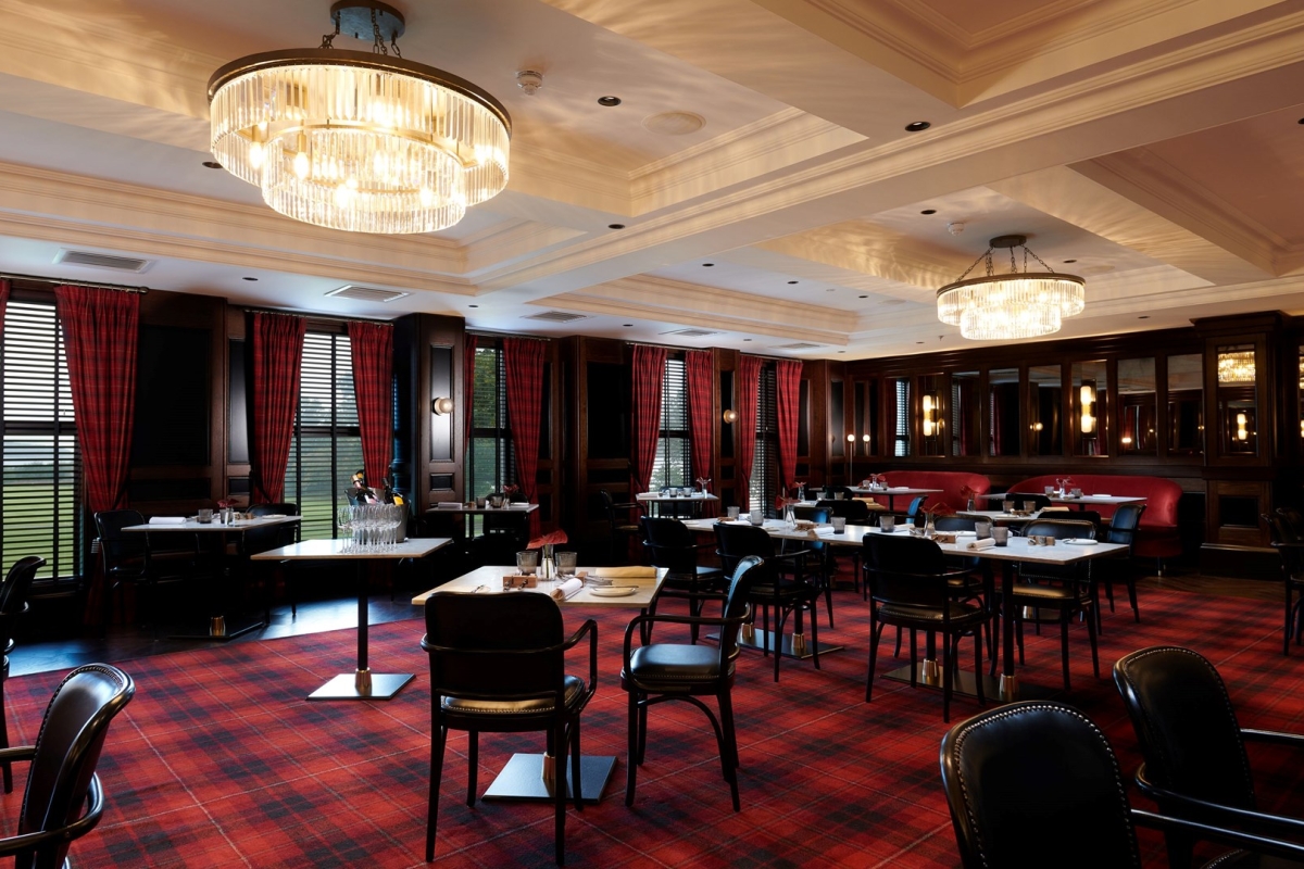 large dining room with plaid flooring and curtains along with black chairs and brown tables