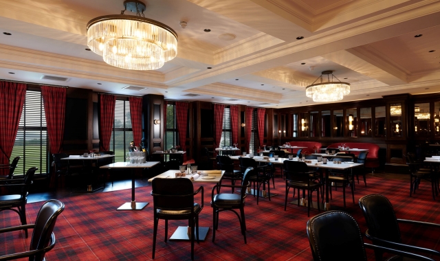 large dining room with plaid flooring and curtains along with black chairs and brown tables