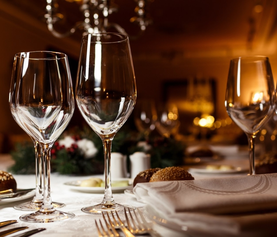 close up view of wine glasses on a table set up for dinner