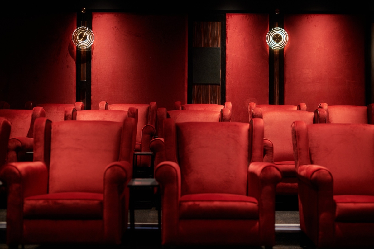Luxurious red velvet seats in the cinema at Cameron House.