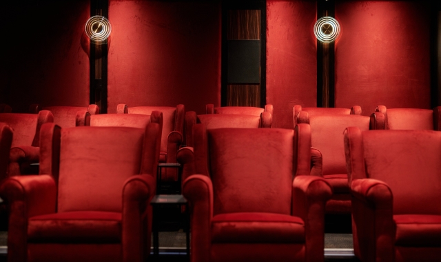 Luxurious red velvet seats in the cinema at Cameron House.