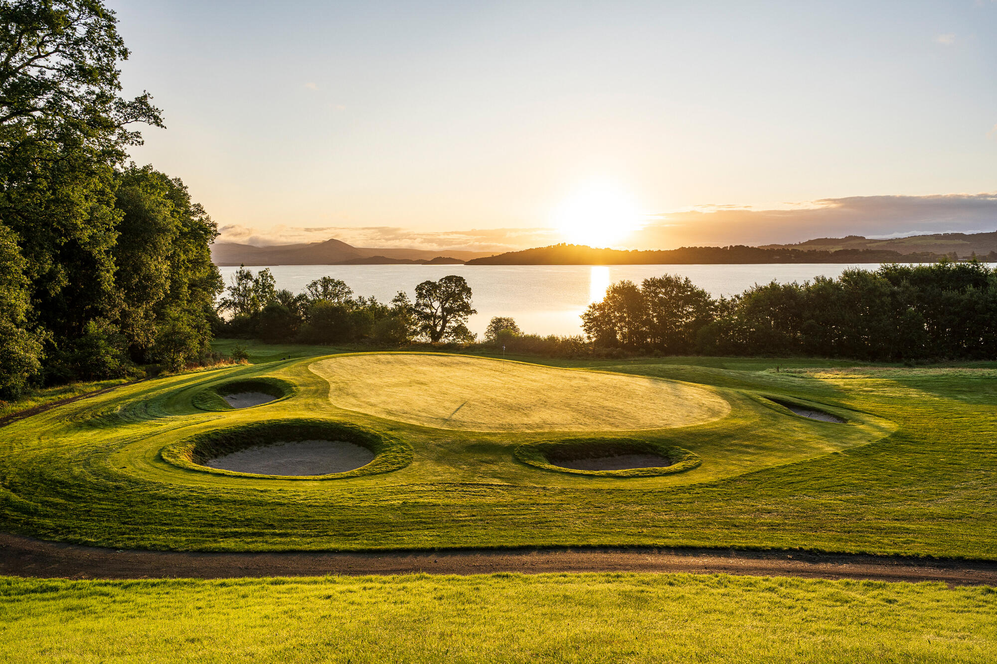 a view of the golf course as the sunsets