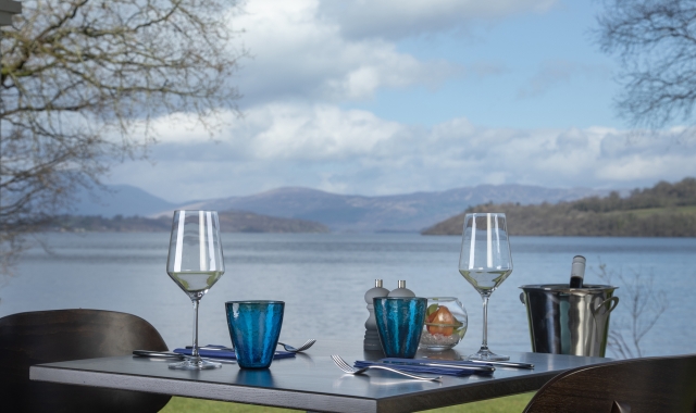 A table with two glasses at La Vista restaurant, overlooking Loch Lomond