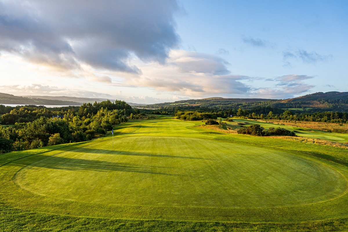 a birds eye view of a golf course on a bright sunny day