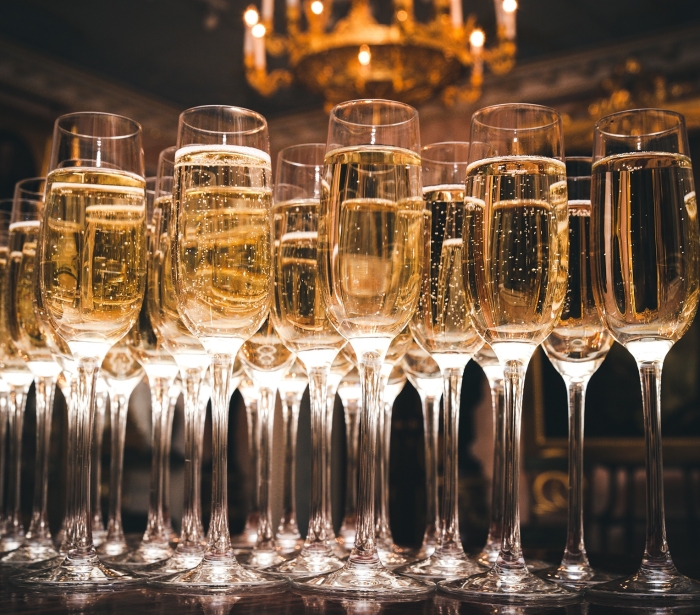 a row of glasses filled with champagne