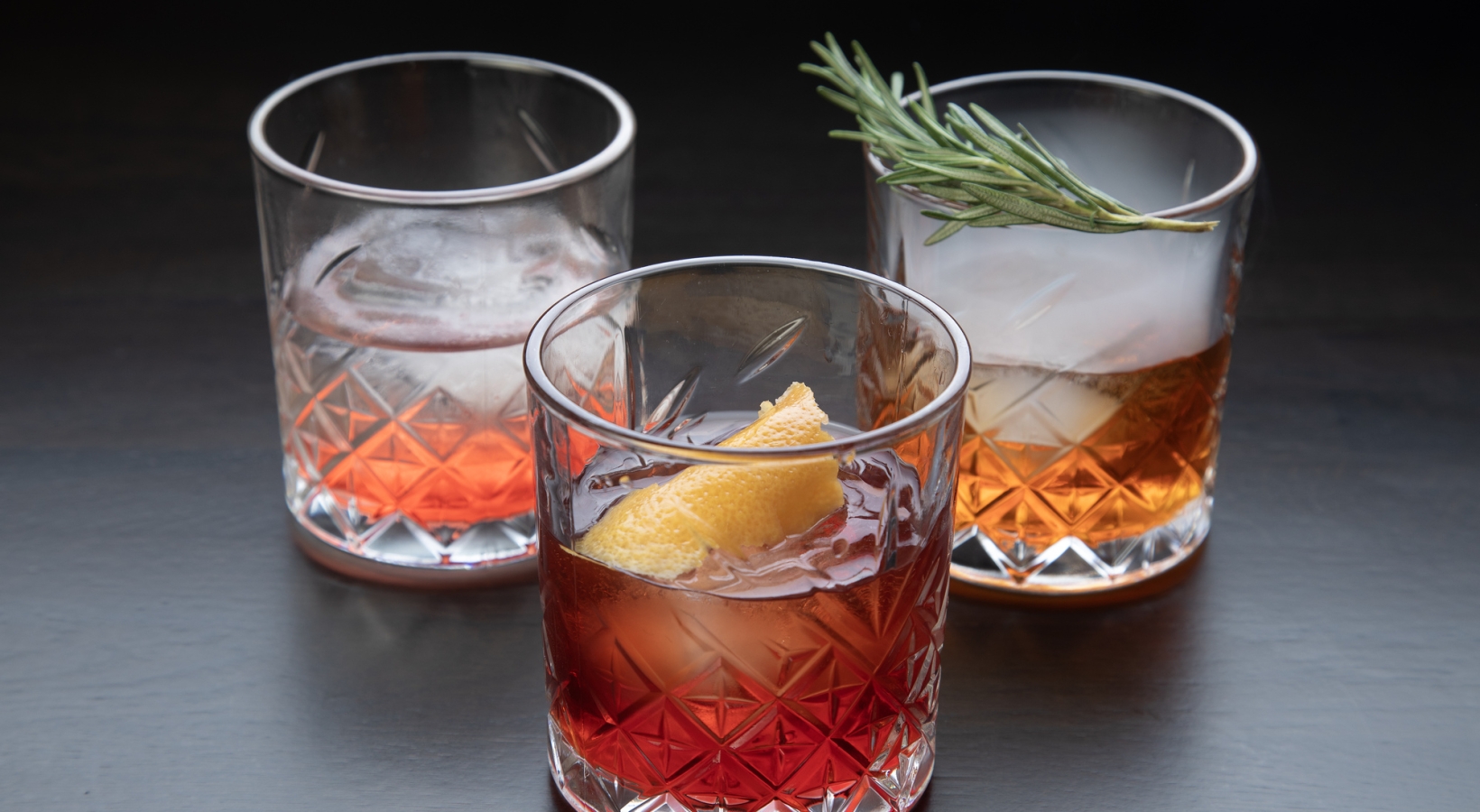 Three glasses with different types of Negroni cocktails on a table at La Vista restaurant, Cameron House.