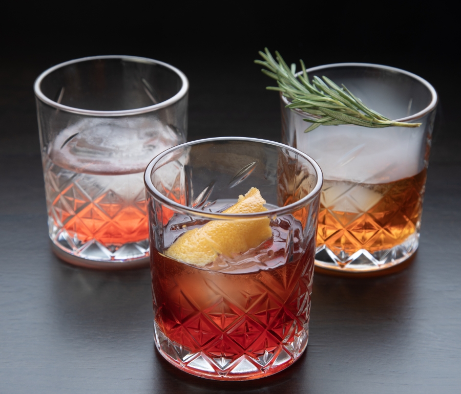 Three glasses with different types of Negroni cocktails on a table at La Vista restaurant, Cameron House.