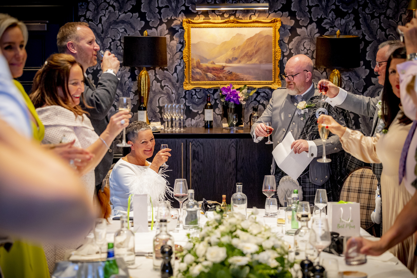 people at a wedding reception after a toast