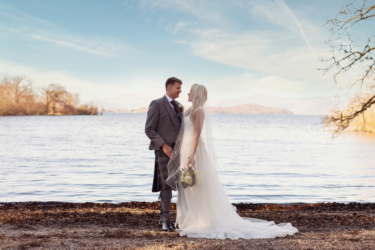 a newly married couple looking into each others eyes