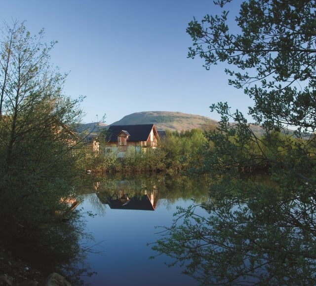 The Carrick Lodges as seen from across the water