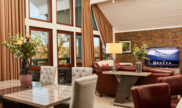 A modern seating area with a dining table and chairs.