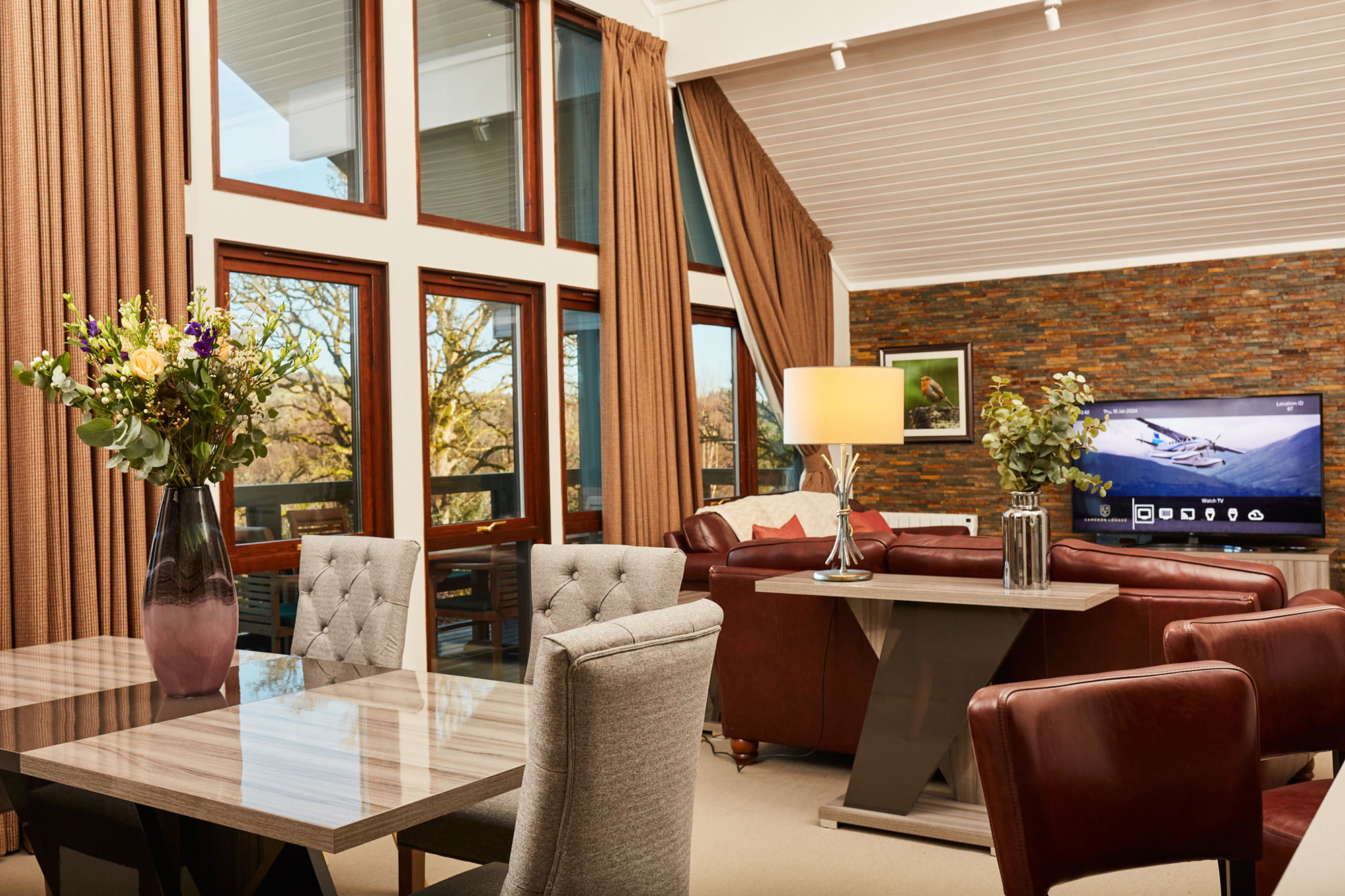 A modern seating area with a dining table and chairs.