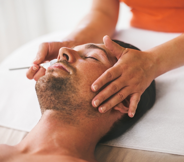 Man receiving a relaxing Spa facial