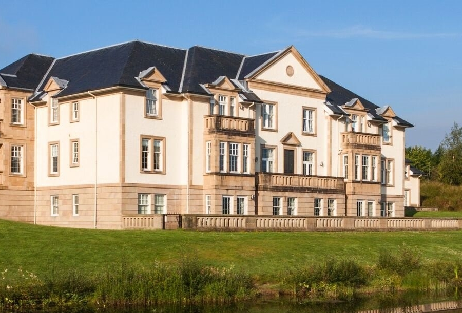 Cameron Lodges Scotland Mansion House Loch Lomond Apartments with pond reflection