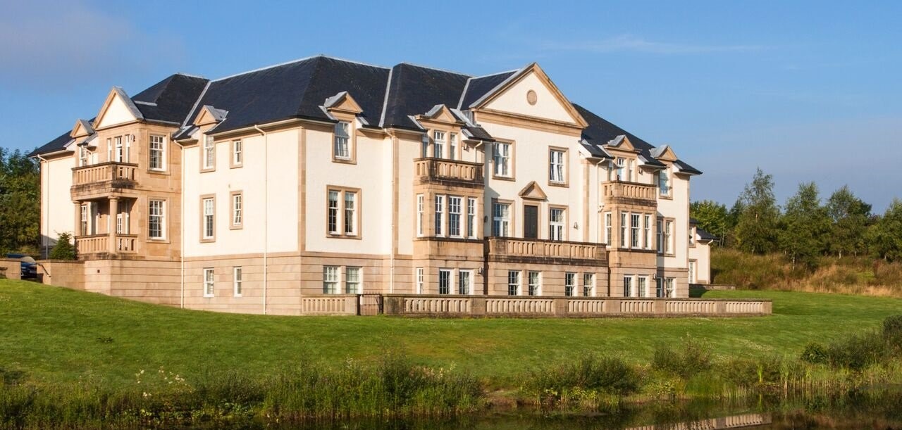 Cameron Lodges Scotland Mansion House Loch Lomond Apartments with pond reflection