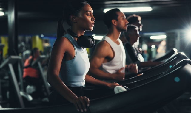 People running on a treadmill in gym
