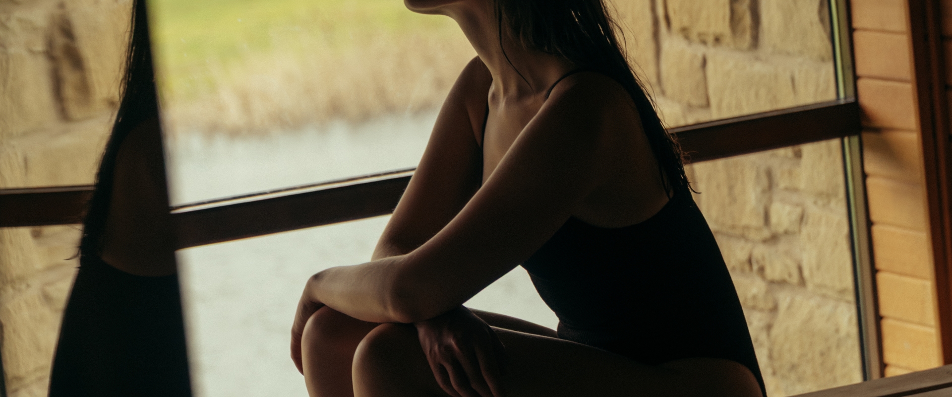 Woman reflecting in the sauna at The Spa at The Carrick