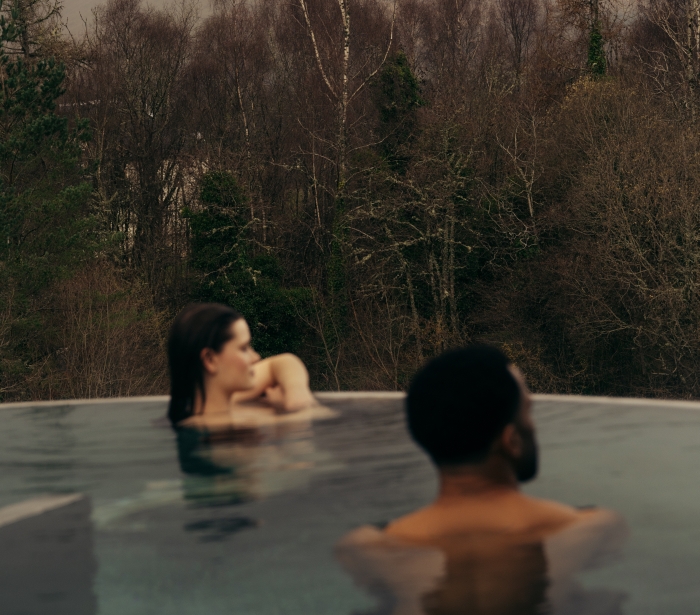 Couple in the rooftop pool at The Spa at The Carrick