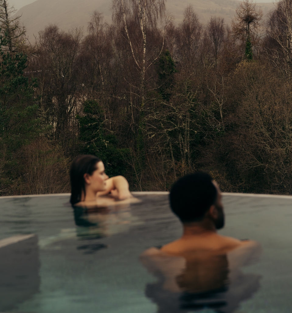 Couple in the rooftop pool at The Spa at The Carrick
