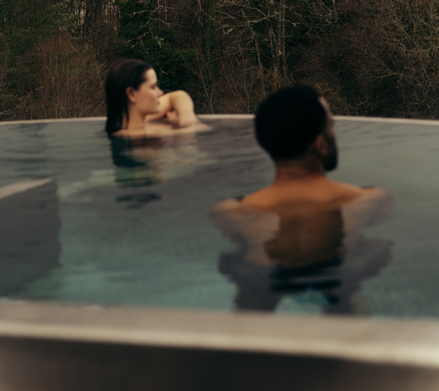 Couple in the rooftop pool at The Spa at The Carrick