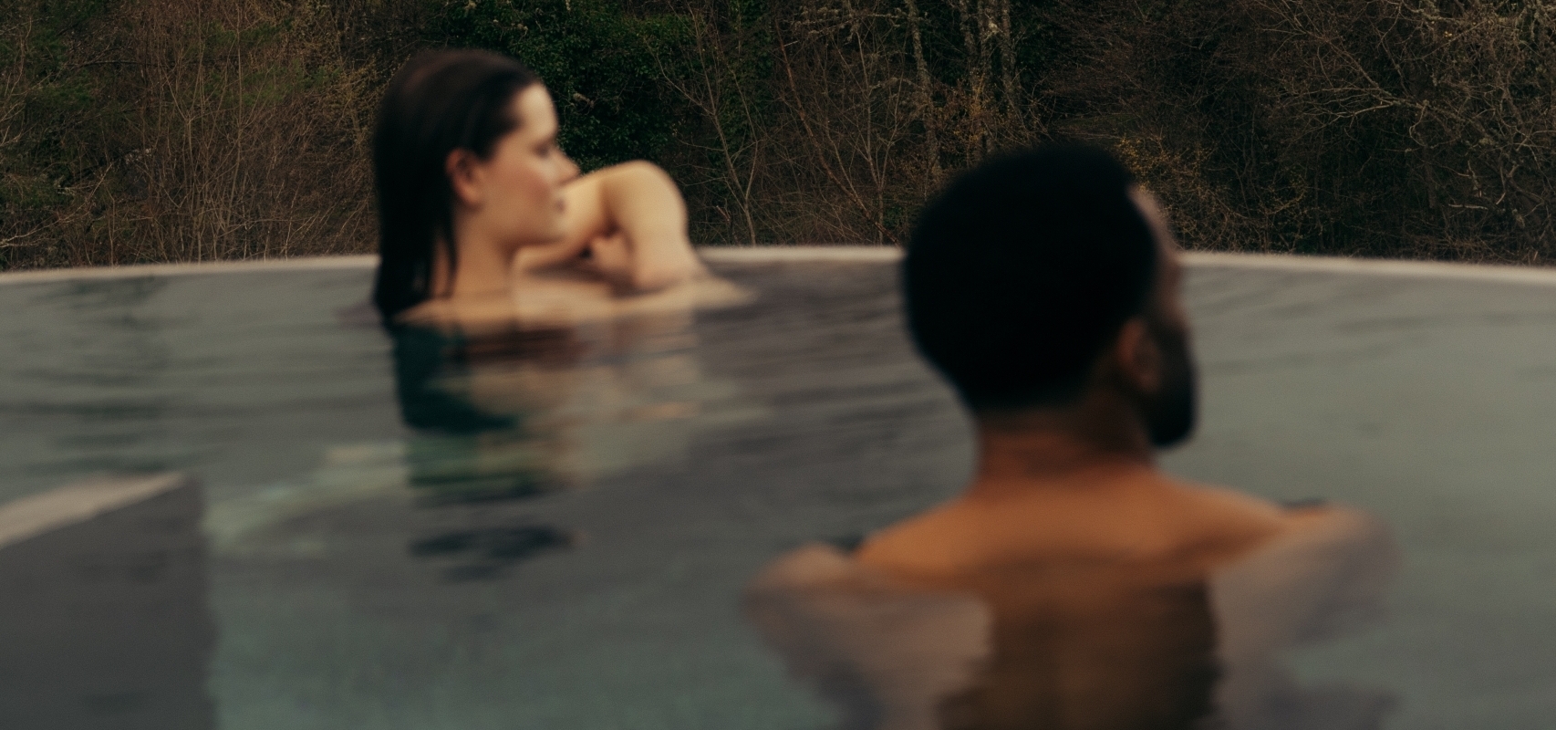 Couple in the rooftop pool at The Spa at The Carrick