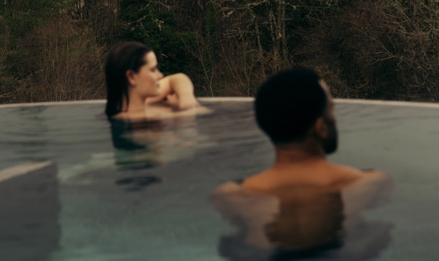 Couple in the rooftop pool at The Spa at The Carrick
