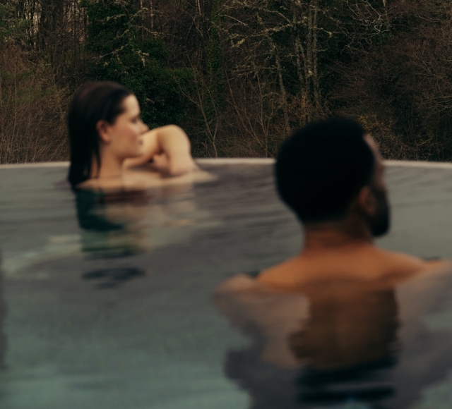 Couple in the rooftop pool at The Spa at The Carrick