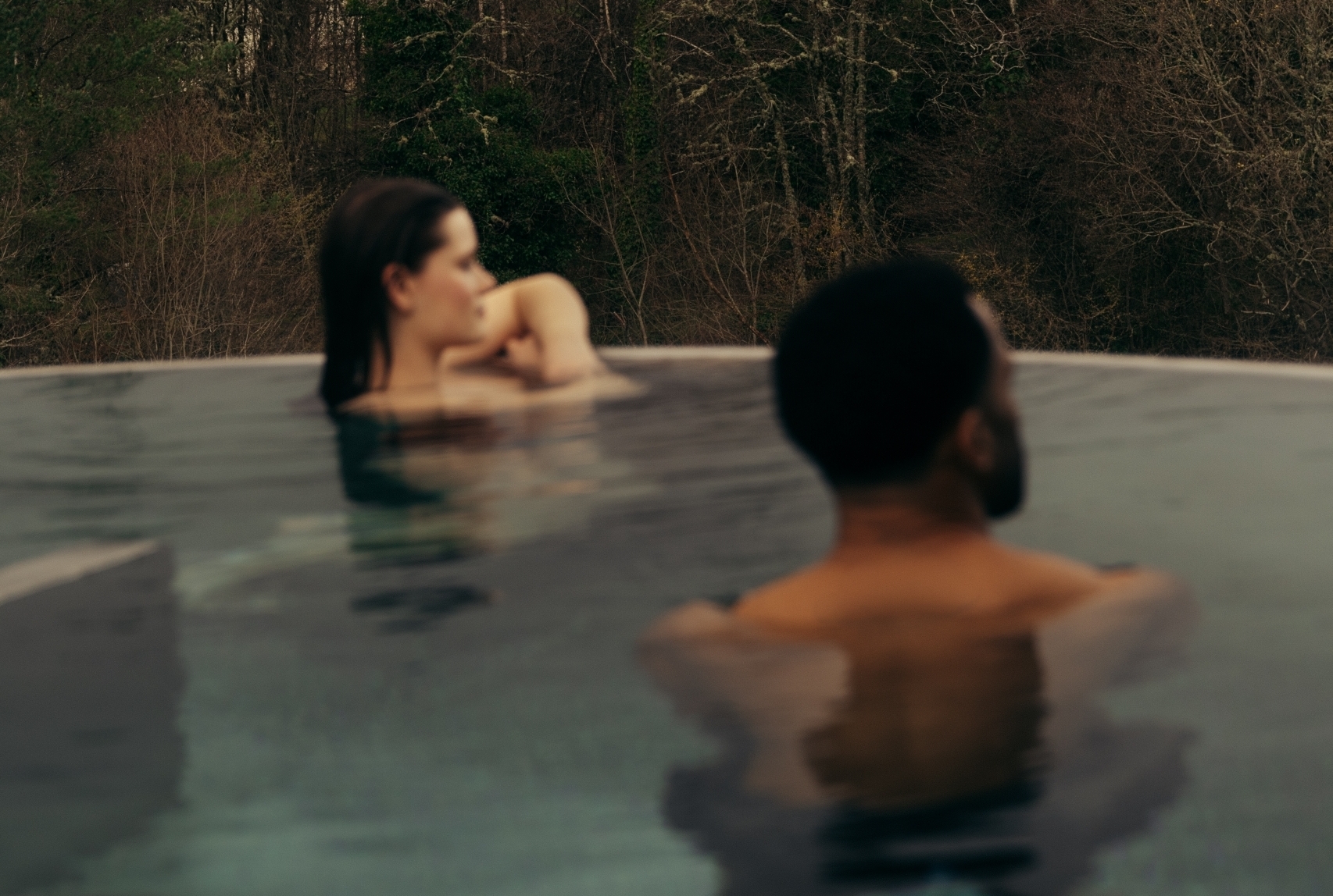 Couple in the rooftop pool at The Spa at The Carrick